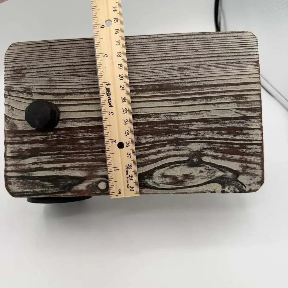 industrial-style wall-mounted toilet paper holder with a rustic wood top shelf